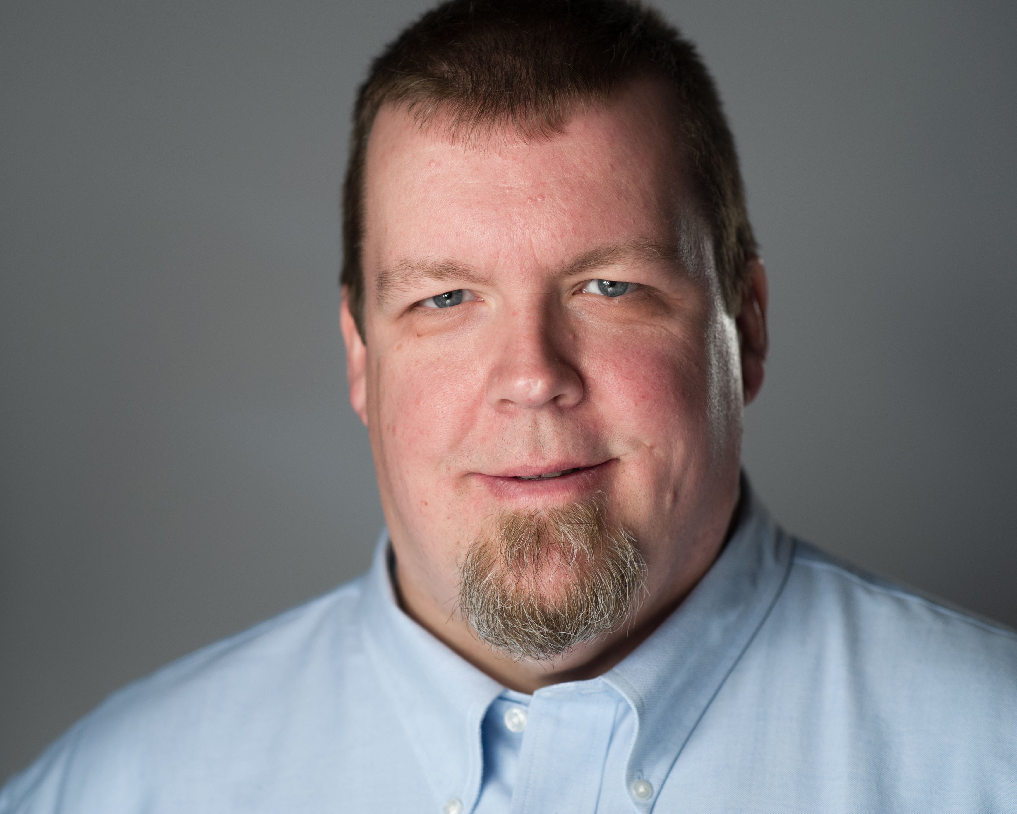Professional headshot of John Turner, a cybersecurity professional with 15+ years of experience